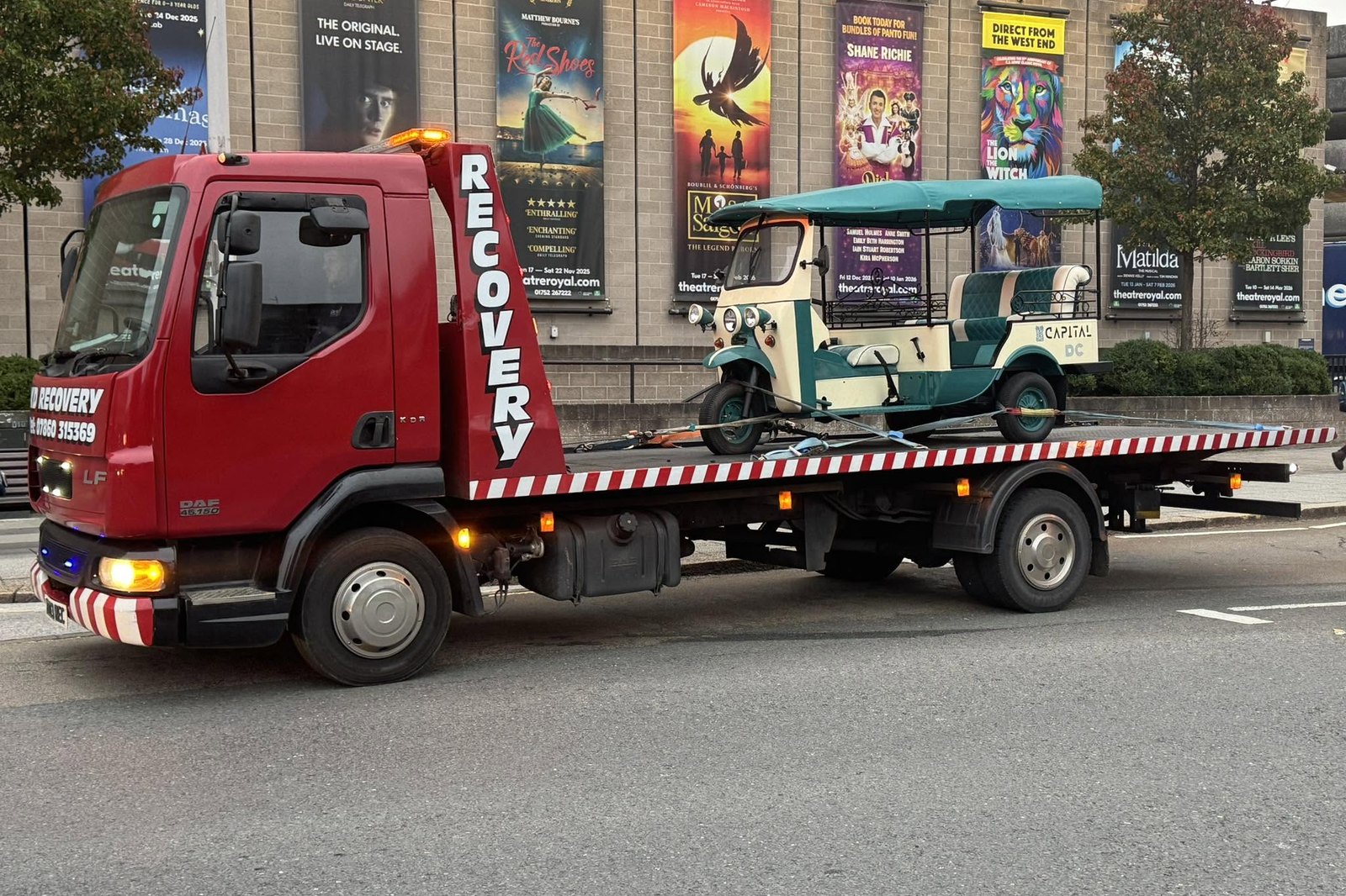 KD Recovery truck collecting a tuk-tuk outside Theatre Royal Plymouth