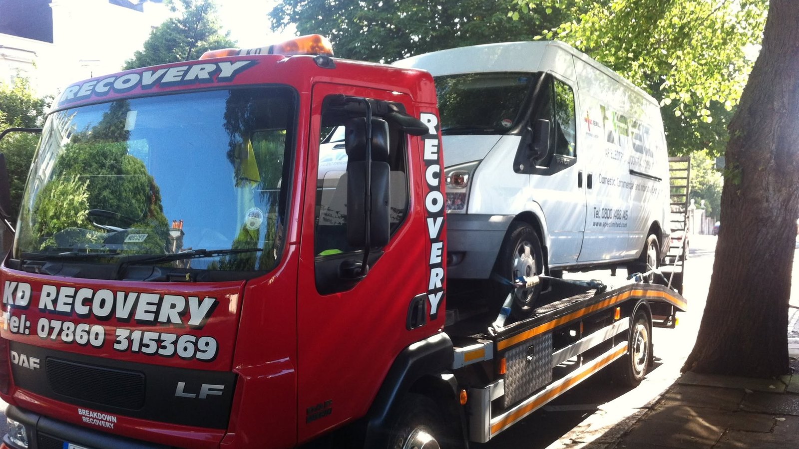 KD Recovery truck loading a van